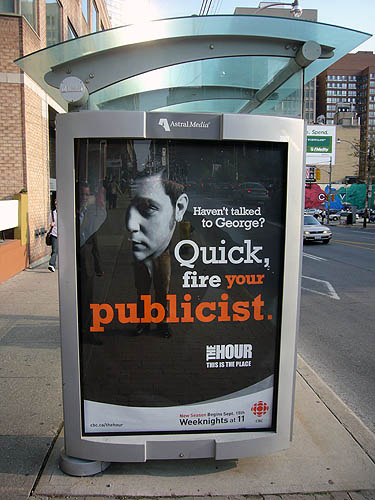Billboard on bus shelter shows Strombo and reads Haven't talked to George? Quick, fire your publicist.
